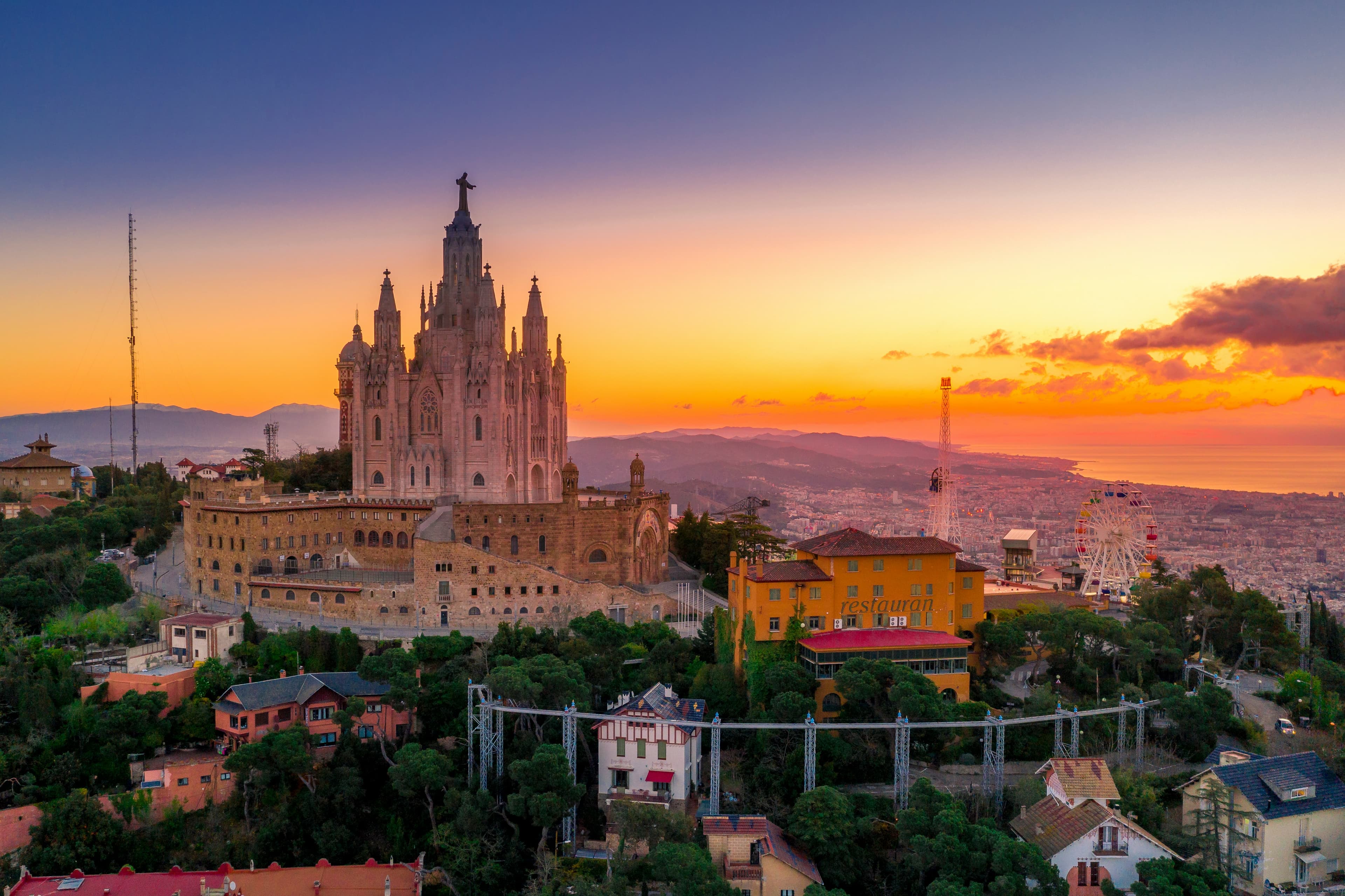 Barcelona city skyline featuring the Sagrada Familia at sunset